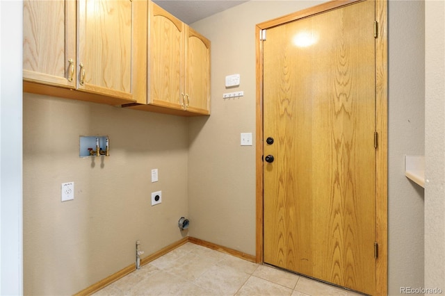 clothes washing area featuring cabinet space, baseboards, washer hookup, electric dryer hookup, and light tile patterned flooring