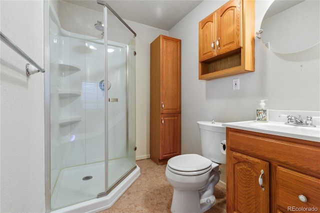 full bathroom with toilet, a shower stall, and vanity