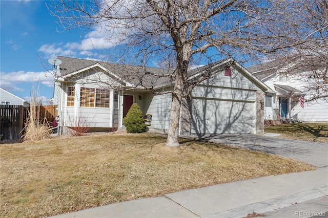 ranch-style home featuring driveway, a garage, fence, and a front lawn