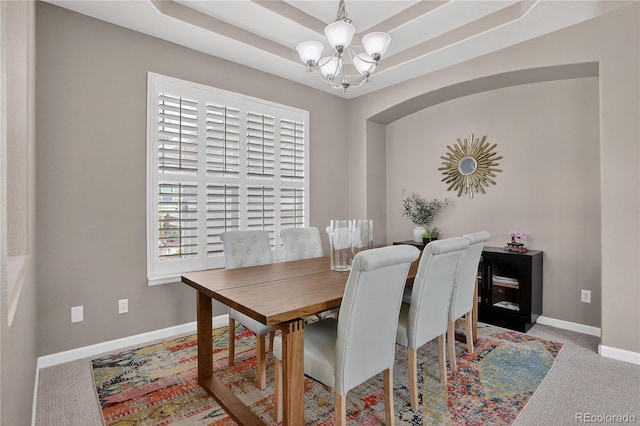 8378 Briar Trace Way, Castle Pines, CO 80108 - dining space featuring a chandelier, carpet floors, and a raised ceiling