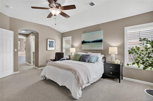 8378 Briar Trace Way, Castle Pines, CO 80108 - bedroom with arched walkways, light carpet, lofted ceiling, ceiling fan, and ensuite bathroom