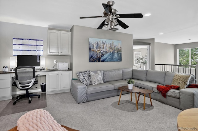 8378 Briar Trace Way, Castle Pines, CO 80108 - living area featuring ceiling fan, light colored carpet, built in desk, and recessed lighting