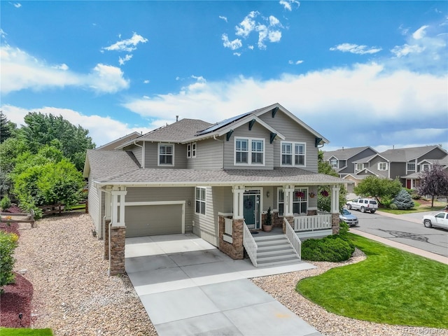 8378 Briar Trace Way, Castle Pines, CO 80108 - craftsman house with covered porch, concrete driveway, roof with shingles, roof mounted solar panels, and an attached garage