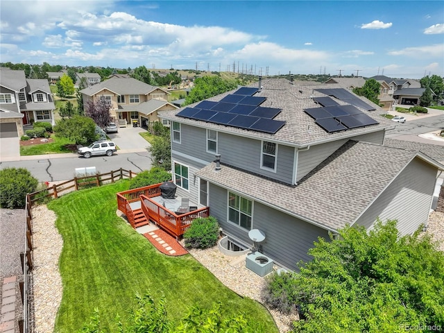 8378 Briar Trace Way, Castle Pines, CO 80108 - back of house with a residential view, a shingled roof, a deck, and solar panels