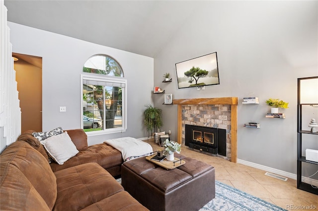 561 James St, Highlands Ranch, CO 80126 - living area featuring high vaulted ceiling, a brick fireplace, and light tile patterned floors