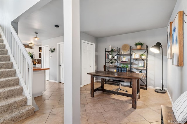 561 James St, Highlands Ranch, CO 80126 - office area with light tile patterned flooring and baseboards