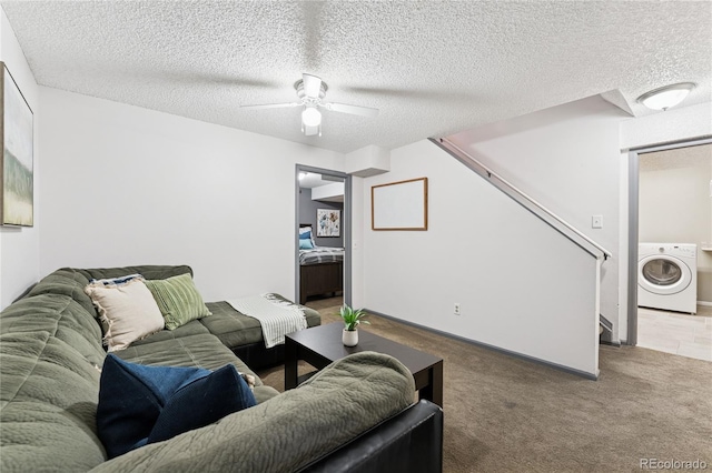 561 James St, Highlands Ranch, CO 80126 - carpeted living room with washer / dryer, stairs, a ceiling fan, and a textured ceiling