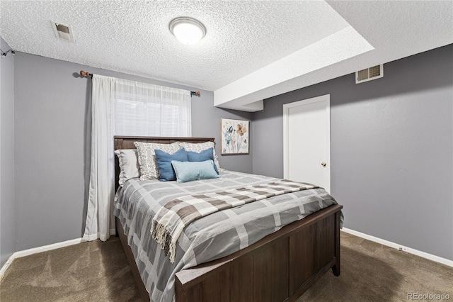 561 James St, Highlands Ranch, CO 80126 - carpeted bedroom featuring a textured ceiling and baseboards