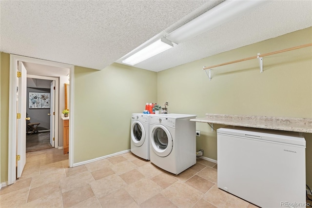 561 James St, Highlands Ranch, CO 80126 - washroom with separate washer and dryer and a textured ceiling