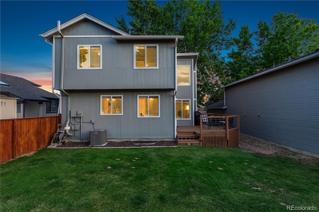 561 James St, Highlands Ranch, CO 80126 - back of house at dusk with a wooden deck
