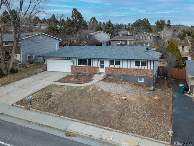 ranch-style house with brick siding, concrete driveway, and a shingled roof