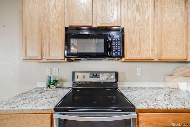 kitchen with black microwave, electric range, light brown cabinetry, and light stone counters