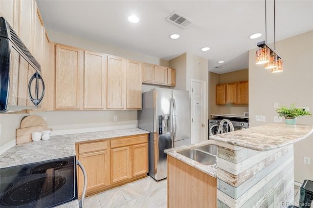 kitchen featuring washer and dryer, light brown cabinetry, stainless steel fridge, electric stove, and recessed lighting