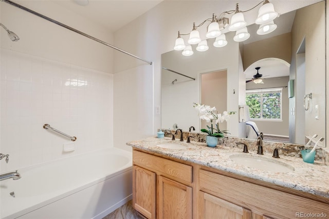 full bathroom with shower / washtub combination, ceiling fan, and double vanity