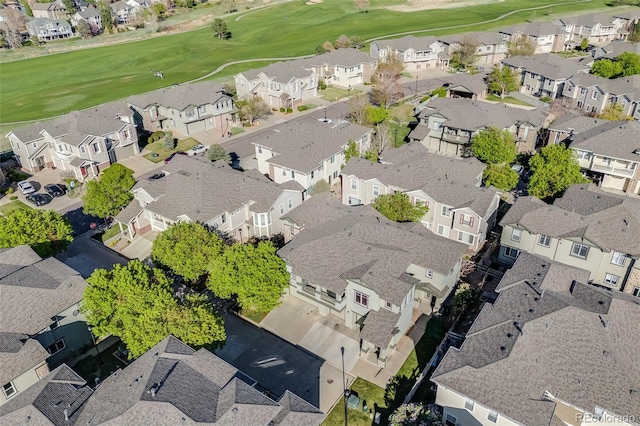 aerial overview of property's location with nearby suburban area and a local golf course