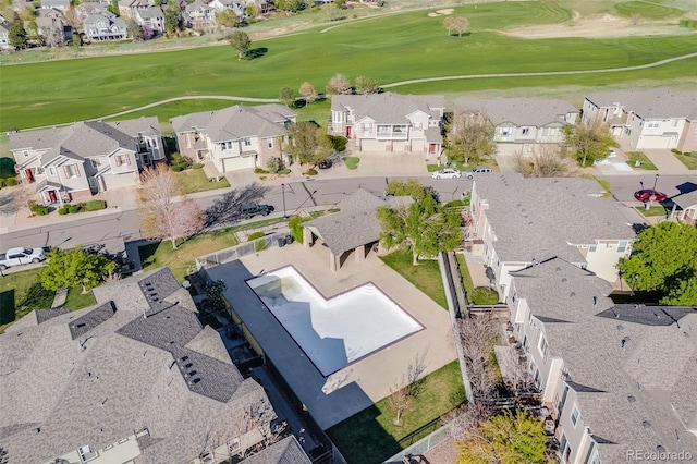 aerial perspective of suburban area featuring a local golf course