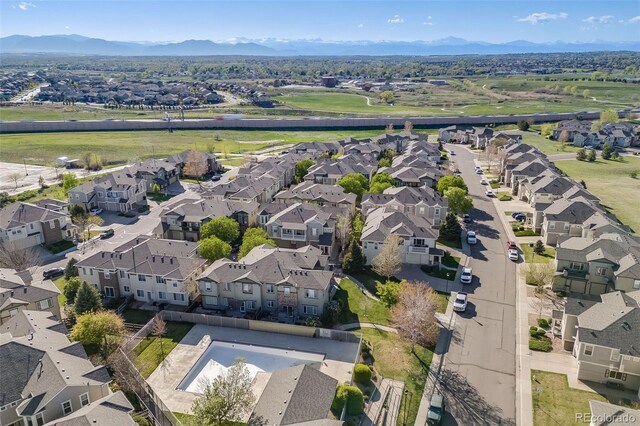 aerial overview of property's location with nearby suburban area and mountains