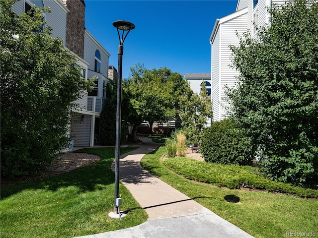 view of home's community with a lawn