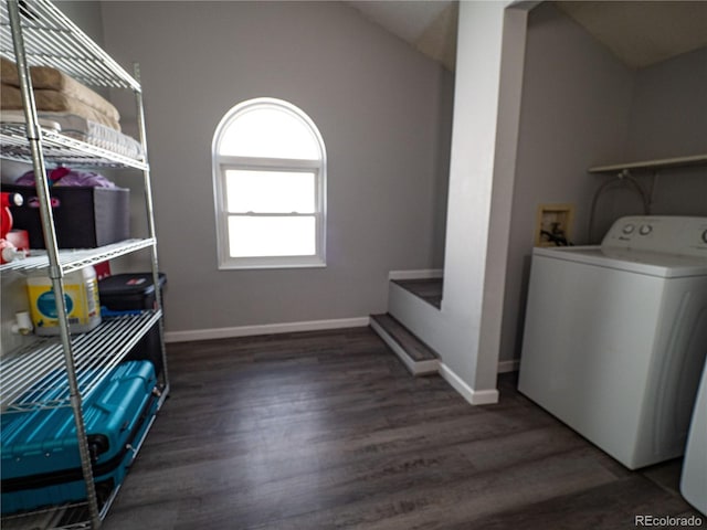 clothes washing area featuring washer / dryer and dark hardwood / wood-style flooring