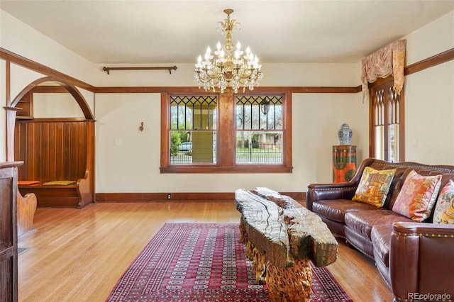 2006 N Cascade Ave, Colorado Springs, CO 80907 - living area with baseboards, light wood-style flooring, and a chandelier