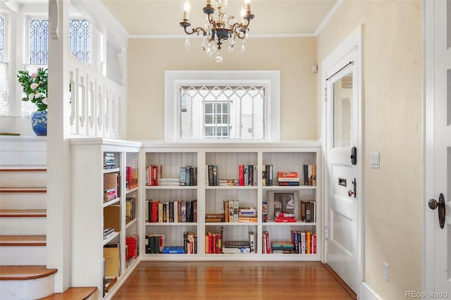2006 N Cascade Ave, Colorado Springs, CO 80907 - interior space featuring crown molding, a notable chandelier, a wealth of natural light, and wood finished floors