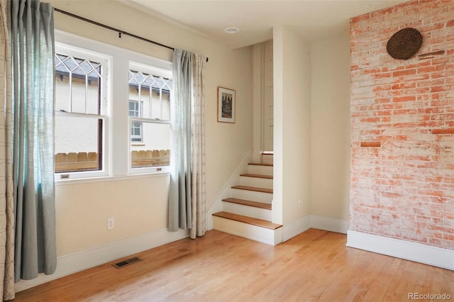 2006 N Cascade Ave, Colorado Springs, CO 80907 - unfurnished room with visible vents, stairs, baseboards, and wood finished floors