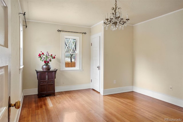 2006 N Cascade Ave, Colorado Springs, CO 80907 - dining area featuring crown molding, baseboards, an inviting chandelier, and light wood-type flooring