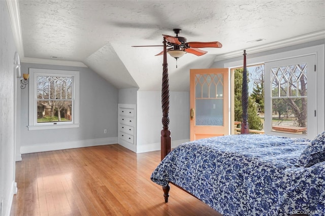 2006 N Cascade Ave, Colorado Springs, CO 80907 - bedroom with baseboards, multiple windows, a textured ceiling, and lofted ceiling