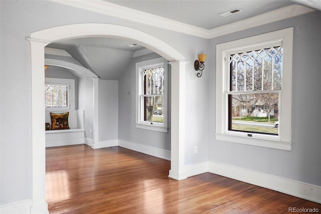 2006 N Cascade Ave, Colorado Springs, CO 80907 - interior space with visible vents, arched walkways, baseboards, and wood finished floors
