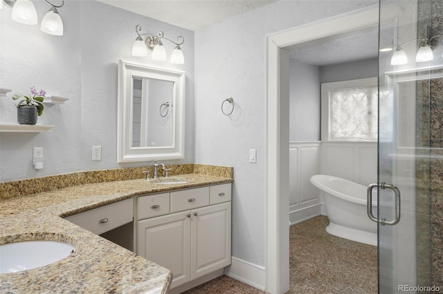 2006 N Cascade Ave, Colorado Springs, CO 80907 - full bath featuring vanity, a textured wall, a soaking tub, and a stall shower