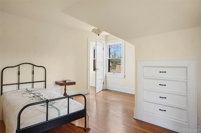 2006 N Cascade Ave, Colorado Springs, CO 80907 - bedroom featuring baseboards, ensuite bath, and wood finished floors