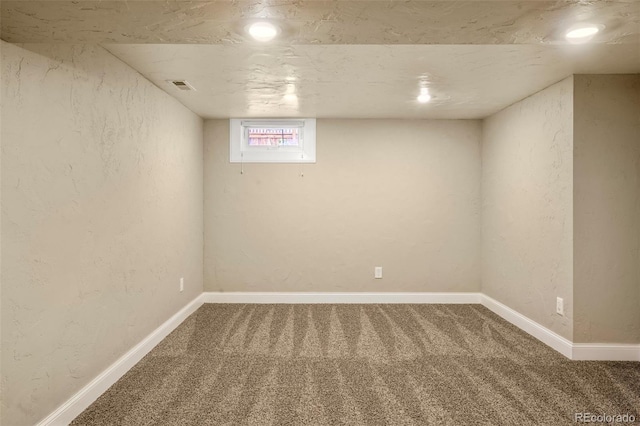2006 N Cascade Ave, Colorado Springs, CO 80907 - below grade area with visible vents, baseboards, a textured wall, carpet, and recessed lighting