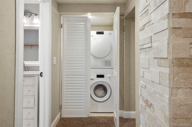 2006 N Cascade Ave, Colorado Springs, CO 80907 - clothes washing area with laundry area, stacked washing maching and dryer, and baseboards