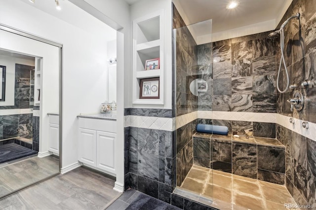 300 W 11th Ave Unit 15C, Denver, CO 80204 - bathroom featuring walk in shower and wood finished floors