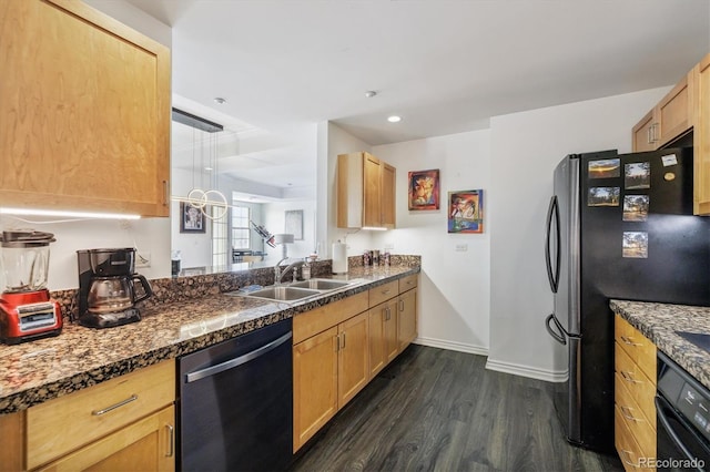 300 W 11th Ave Unit 15C, Denver, CO 80204 - kitchen with appliances with stainless steel finishes, a sink, dark wood-style flooring, baseboards, and dark countertops