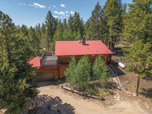 18680 Wapiti Cir, Buena Vista, CO 81211 - cabin featuring a metal roof, dirt driveway, and a forest view