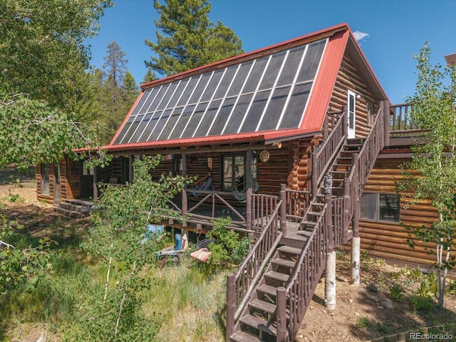 18680 Wapiti Cir, Buena Vista, CO 81211 - back of house featuring stairway, log exterior, and a deck
