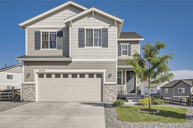 21038 E Quincy Pl, Aurora, CO 80015 - craftsman inspired home with stone siding, a garage, and concrete driveway