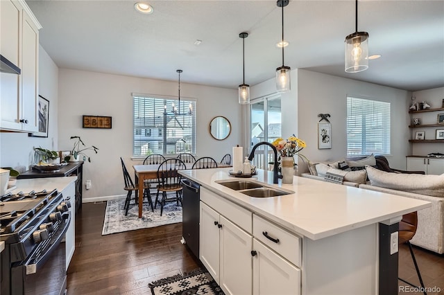 21038 E Quincy Pl, Aurora, CO 80015 - kitchen with plenty of natural light, open floor plan, dishwashing machine, dark wood-style floors, and recessed lighting