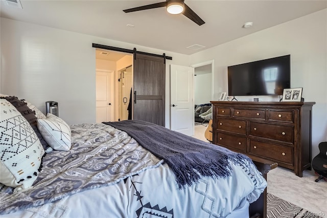 21038 E Quincy Pl, Aurora, CO 80015 - bedroom with a barn door, light colored carpet, and a ceiling fan