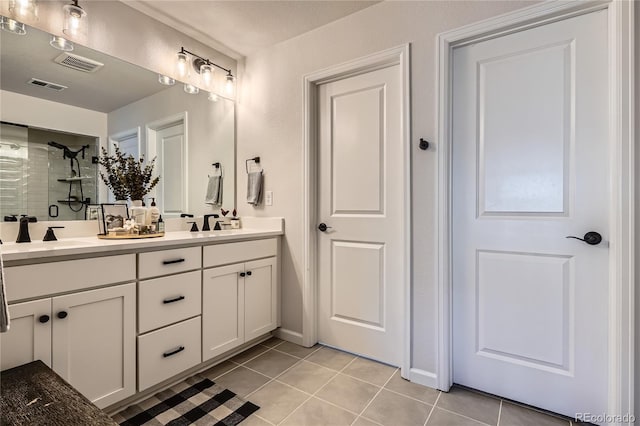 21038 E Quincy Pl, Aurora, CO 80015 - full bath featuring double vanity, tile patterned floors, and tiled shower
