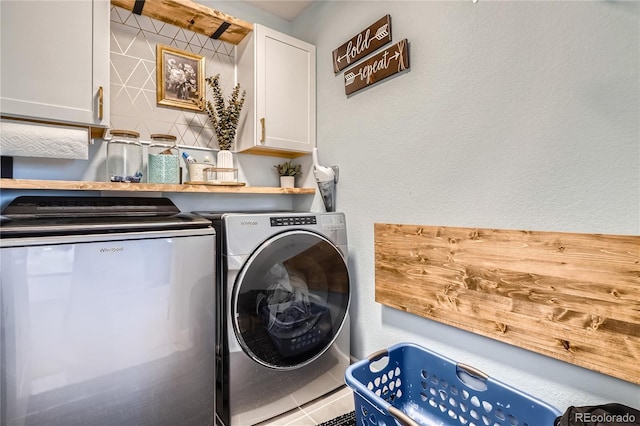21038 E Quincy Pl, Aurora, CO 80015 - laundry room with washing machine and dryer, cabinet space, and a textured wall
