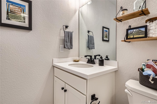 21038 E Quincy Pl, Aurora, CO 80015 - half bathroom featuring vanity and a textured wall