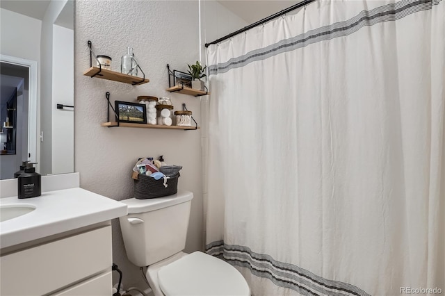 21038 E Quincy Pl, Aurora, CO 80015 - full bathroom featuring vanity, a textured wall, and a shower with curtain