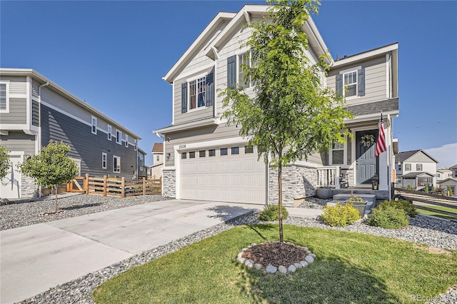 21038 E Quincy Pl, Aurora, CO 80015 - view of front of home with a garage, stone siding, driveway, and a residential view