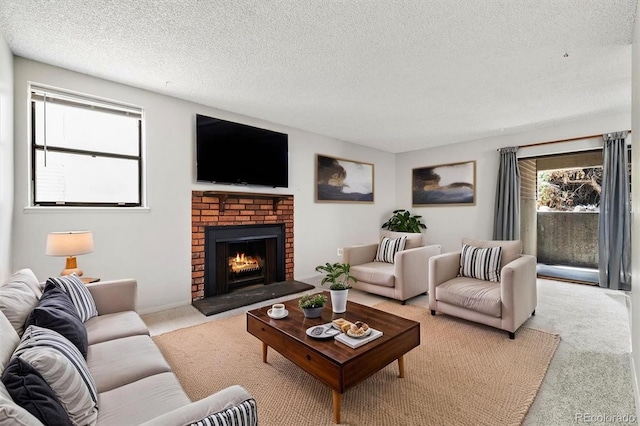 15202 E Hampden Cir Unit F2, Aurora, CO 80014 - living area with carpet floors, healthy amount of natural light, a textured ceiling, and a fireplace