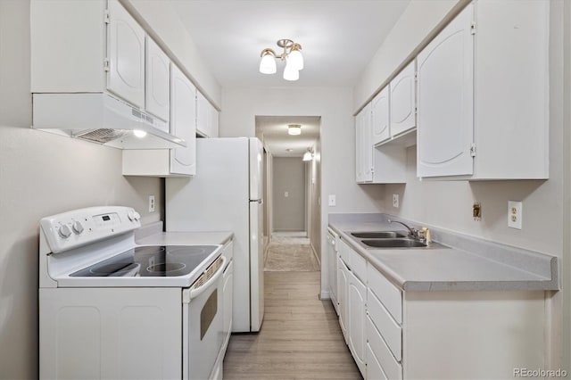 15202 E Hampden Cir Unit F2, Aurora, CO 80014 - kitchen featuring electric stove, under cabinet range hood, white cabinetry, and light countertops