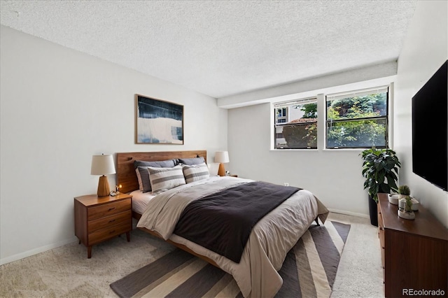 15202 E Hampden Cir Unit F2, Aurora, CO 80014 - bedroom featuring carpet floors and a textured ceiling