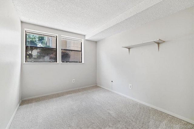 15202 E Hampden Cir Unit F2, Aurora, CO 80014 - spare room with carpet floors and a textured ceiling