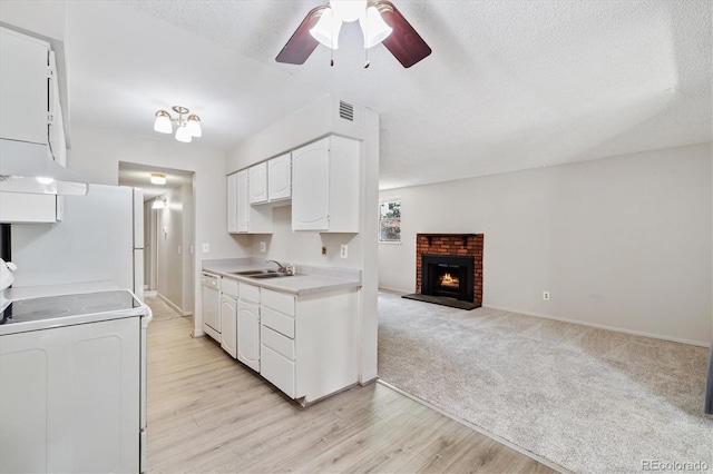 15202 E Hampden Cir Unit F2, Aurora, CO 80014 - kitchen featuring white appliances, a ceiling fan, light countertops, under cabinet range hood, and white cabinets